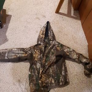 Two hunting coats and a adjustable hunting bibs